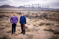 Figure 15: SNL computer scientists Casey Doyle, left, and Kevin Stamber stand in front of an electrical switching station.  Their team has developed a computer model to determine the optimal order to restore power to the substations and infrastructure of a grid after a total disruption, a process called a black start.  (Photo by Craig Fritz)